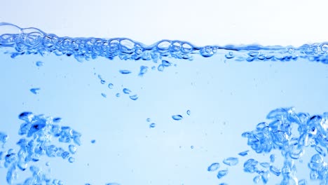 many bubbles in water close up, abstract water wave with bubbles in slow motion