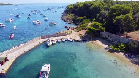 Flying-away-from-the-port-of-Saint-Honorat-island-part-of-the-Iles-de-Lérins,-next-to-Cannes-in-south-of-France