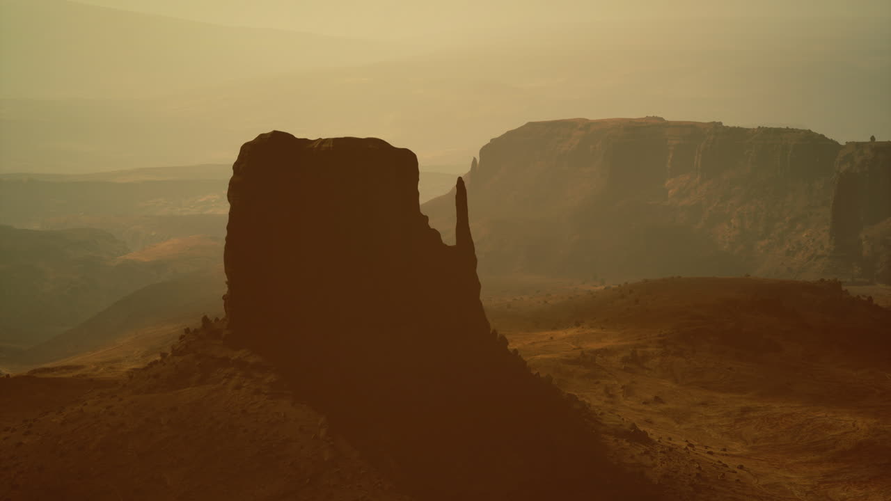 Majestic rock formations under soft sunlight in a serene landscape