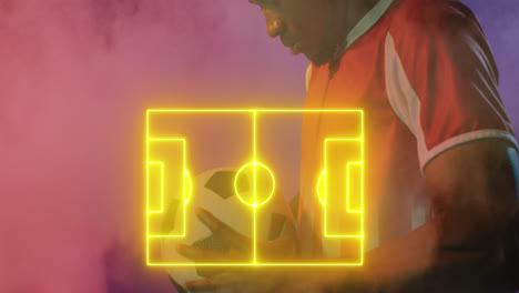 animation of yellow football pitch and smoke over african american male football player holding ball