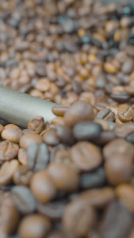 coffee beans being processed in a roasting machine