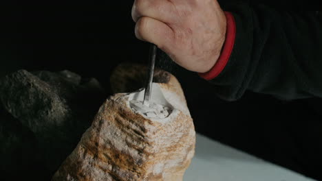 carving a mammoth tusk