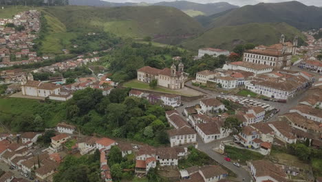 a picturesque vista of ouro preto, a colonial town, framed by lush green mountains, designated as a unesco world heritage site in minas gerais, brazil