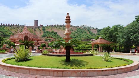 artistic-red-stone-jain-temple-at-morning-from-unique-angle-video-is-taken-at-Shri-Digamber-Jain-Gyanoday-Tirth-Kshetra,-Nareli-Jain-Mandir,-Ajmer,-Rajasthan,-India-an-Aug-19-2023.