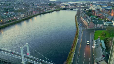 passing close to the free church steeple over the grieg st bridge and river ness