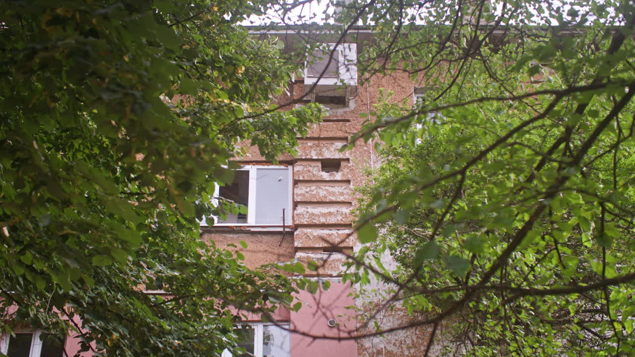 A neighborhood with communist architecture apartment buildings and the surrounding neighborhood environment, garden and trees from the communist era on the Balkans in Sofia, Bulgaria, Eastern Europe