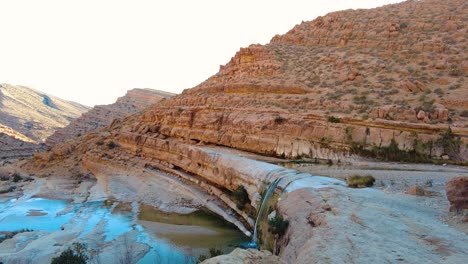 a waterfall in the middle of the sahara desert algeria biskra