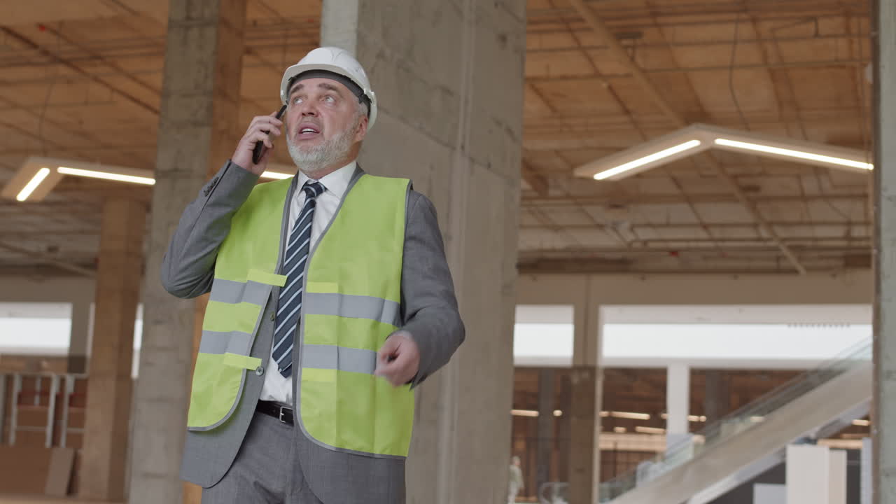 Architect Talking on Phone in Construction