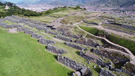 terraced fields with stone walls of old culturally significant site in peru, aerial