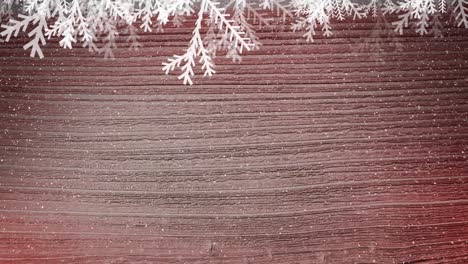 Animation-of-fir-tree-branches-and-over-snow-falling