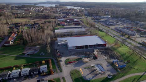 construction site, aerial pullback revealing in nordic country