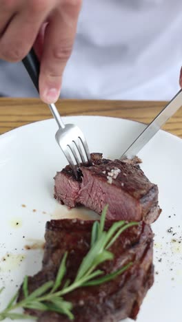 chef cutting a delicious steak