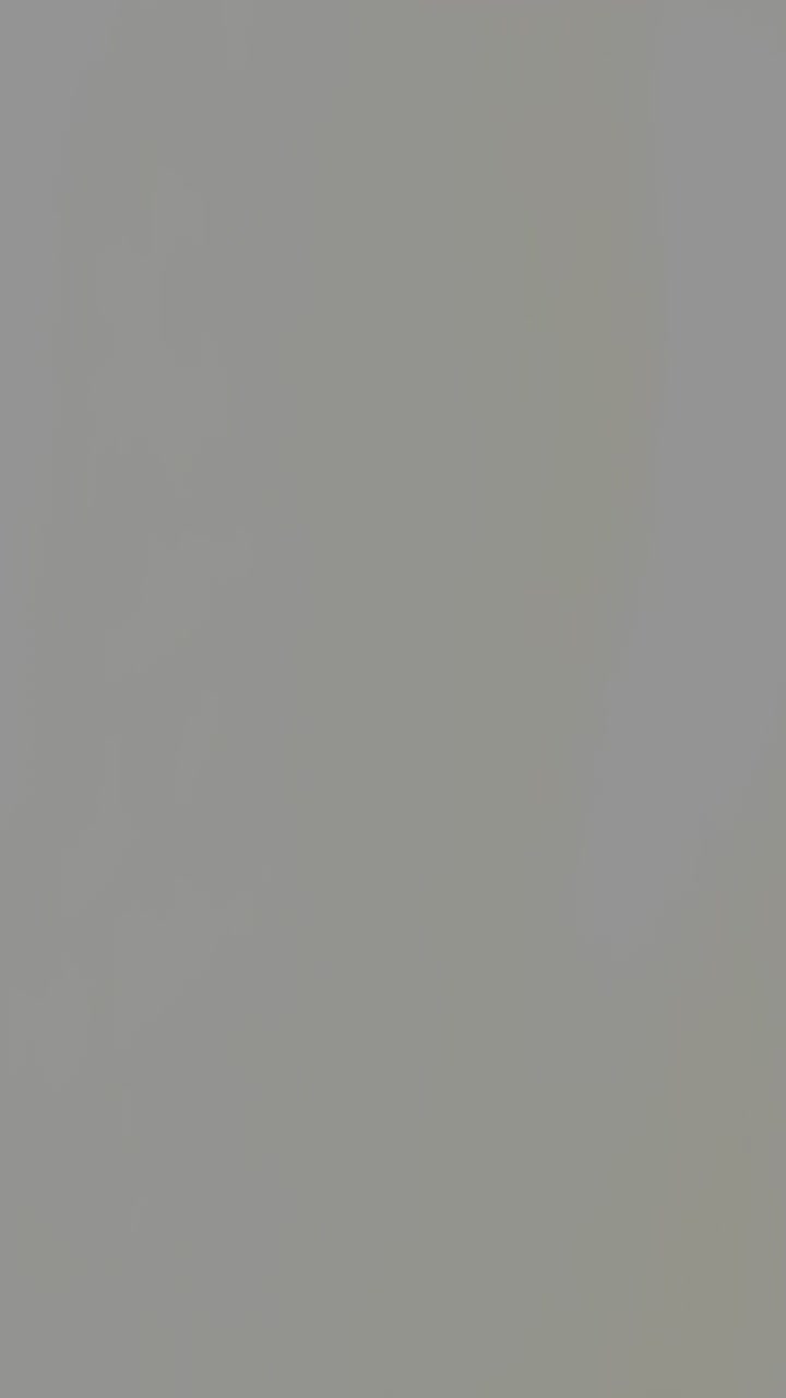 Abstract Gradient Background Transitioning From Dark Brown to Light Gray