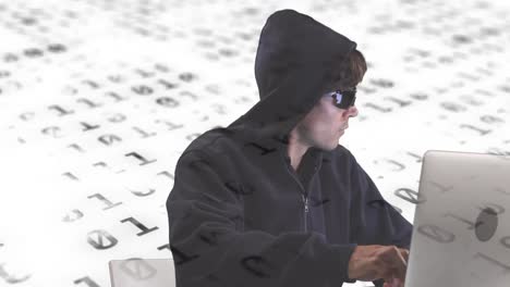 digital composition of male hacker using laptop against binary coding data processing on white backg