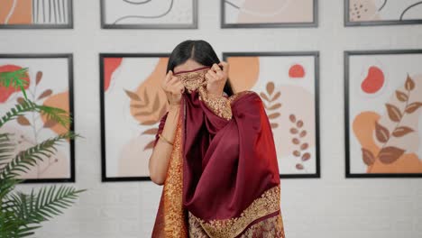 indian woman scared hiding her face
