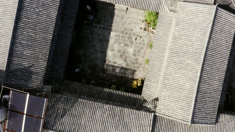 traditional chinese rooftop architecture in rural village, rising aerial view