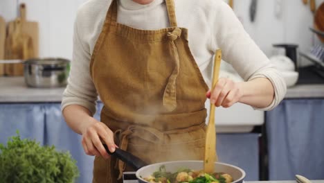 female cooking stew at home