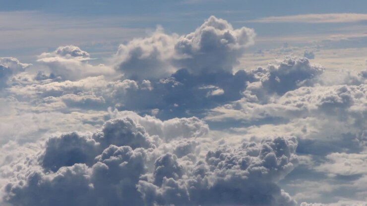Clouds sky viewed from the windows of an airplane. Flying above the clouds, flying in the air.