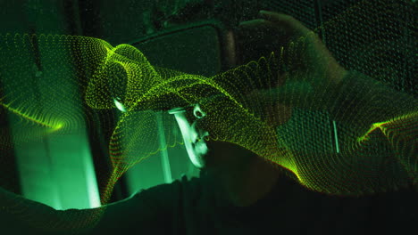 animation of digital wave patterns flowing over person in dark environment