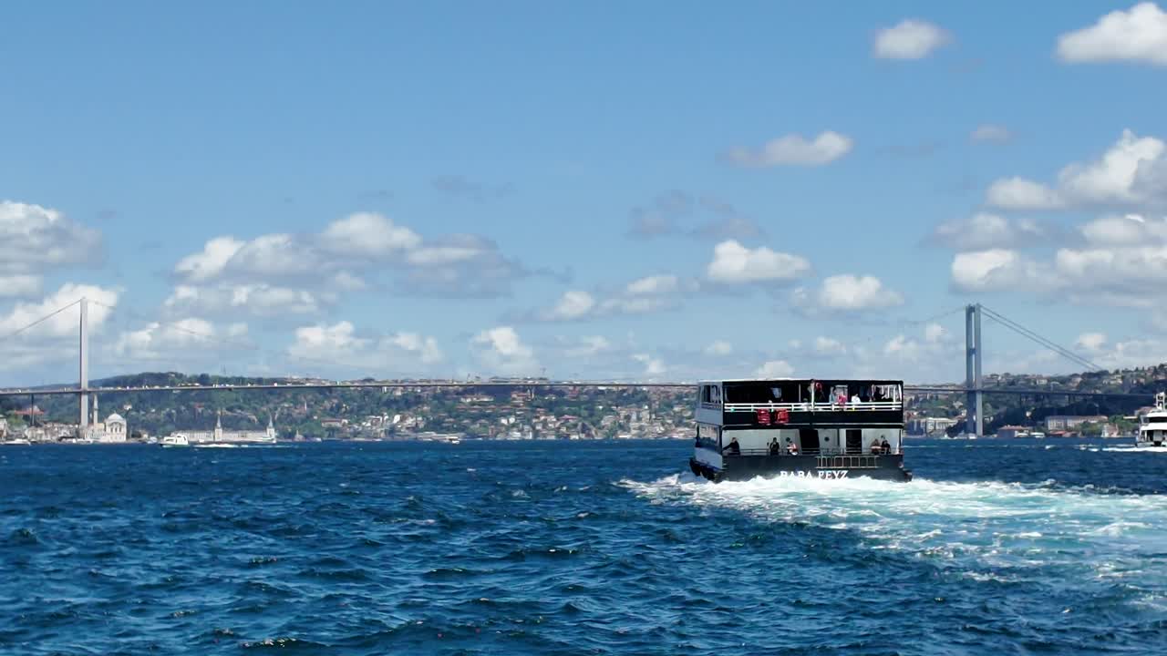 Boat on the Sea with Bridge and Cityscape