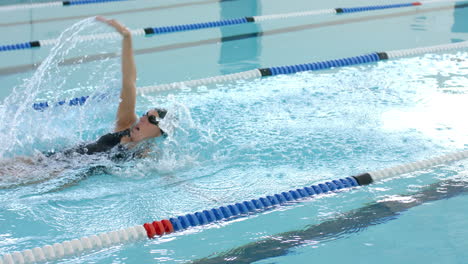 caucasian female swimmer athlete swimming in a pool