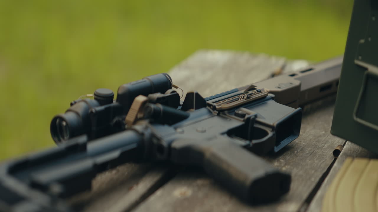 Close-up of an AR-15 on a wooden table