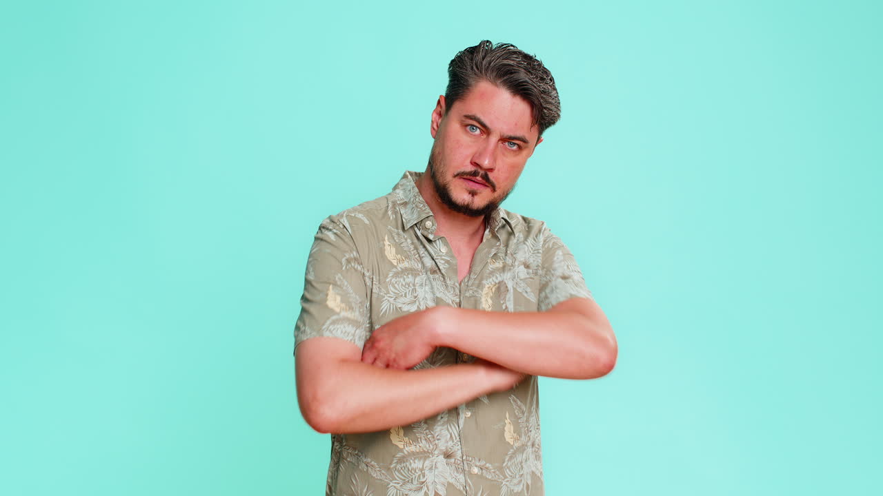 Adult man pointing two fingers to eyes forward showing suspicious attention warning watchful gesture