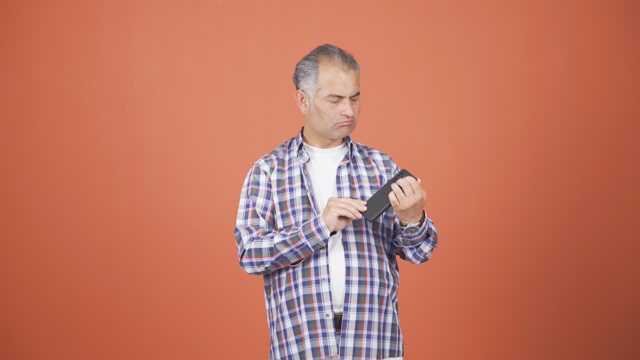 The man who can't use the app on the phone.