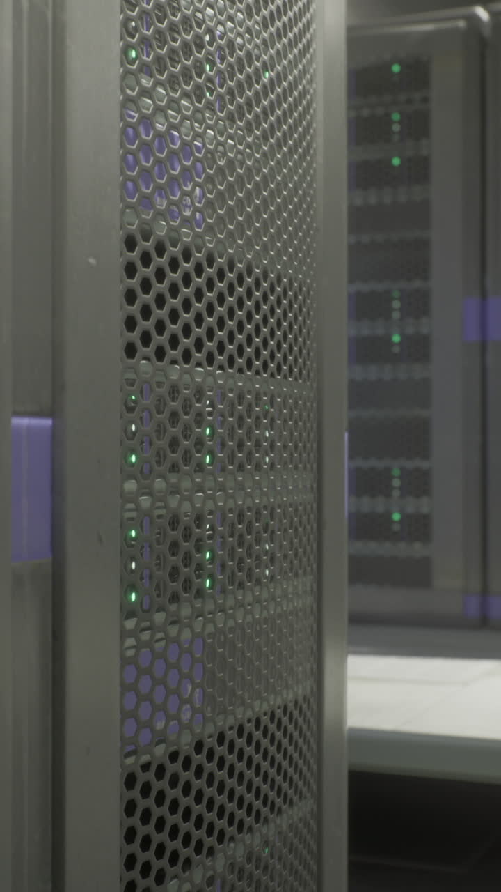 Data center with multiple server racks illuminated by green lights