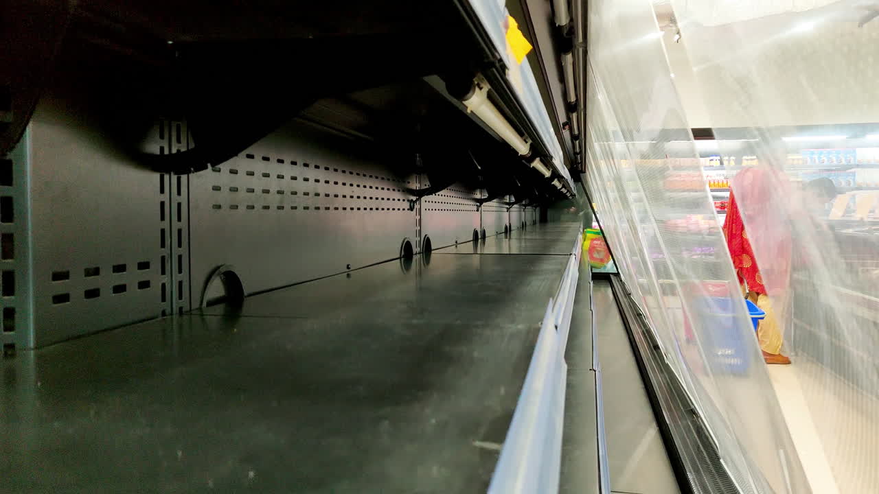 Empty shelves at a grocery store due to panic buying and shortage of supplies amid coronavirus pandemic