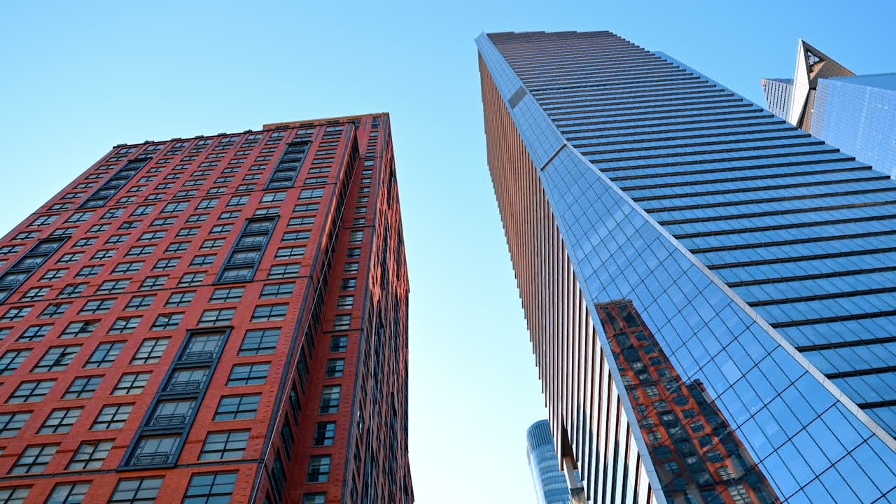 Modern high-rise buildings from low-angle perspective. Watching the contemporary architecture of Big Apple at daytime