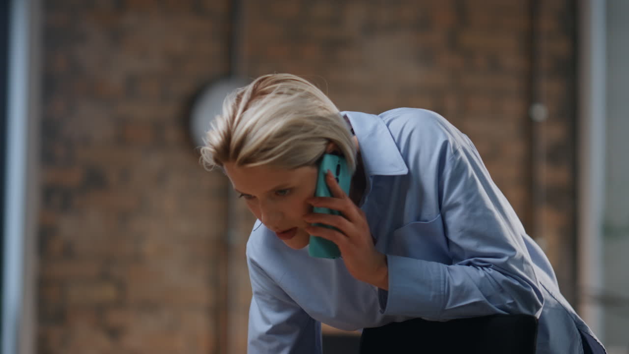Lady making order calling cellphone standing office closeup. Woman talking phone