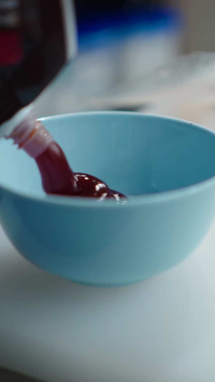 Sauce being poured into a bowl