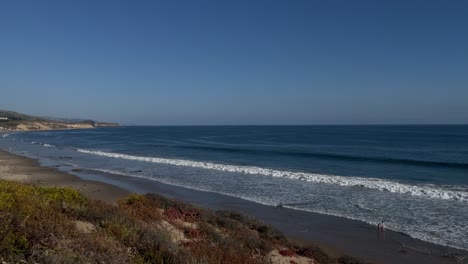 slow panning right view of the beach at crystal cove state park in corona del mar california