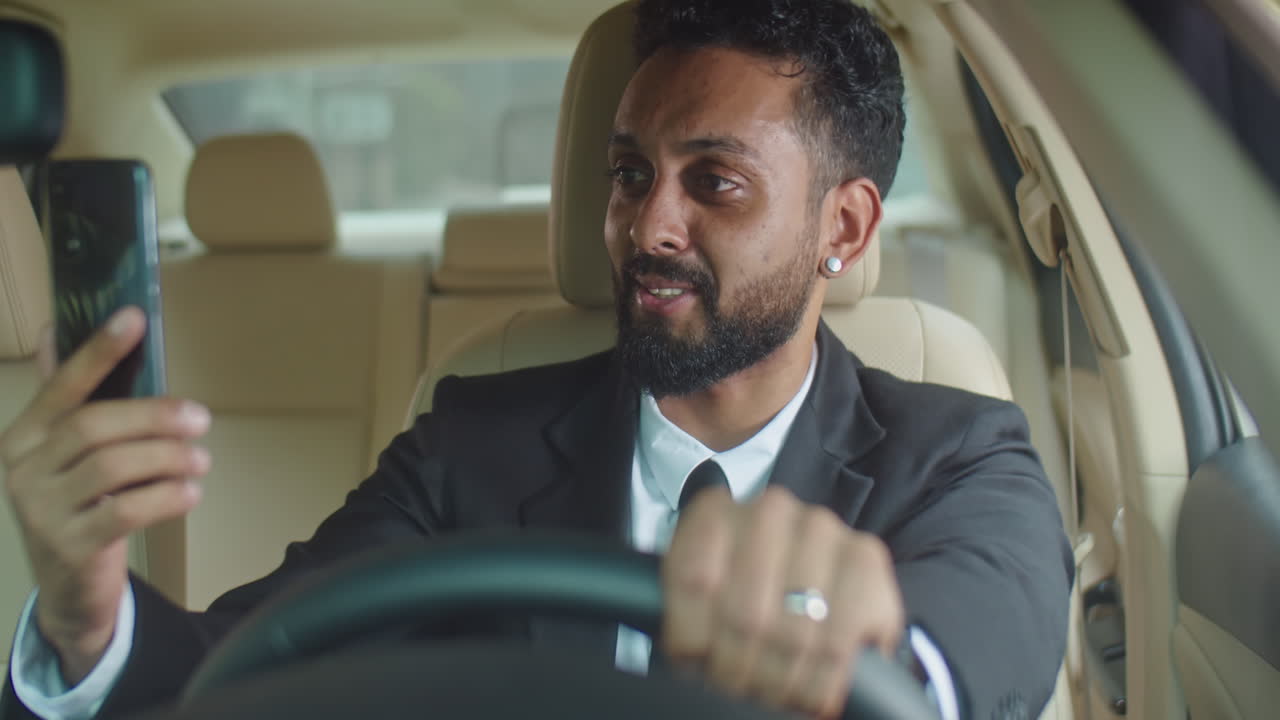 Businessman Talking on Video Call in Car