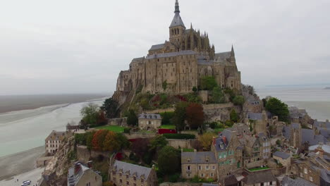 french castle on a small island in france le mont saint michel drone shot close up in normandy typical gothic architecure unesco world heritage class