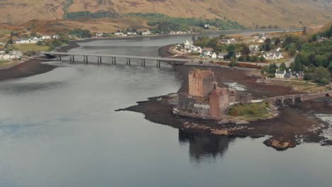 Drone shot of medieval Eilean Donan medieval Castle in Scotland