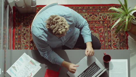 Excited-Businessman-Celebrating-Achievement-at-Office-Workplace