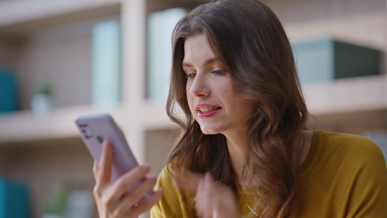 Nervous businesswoman talking smartphone complaining on work at office closeup
