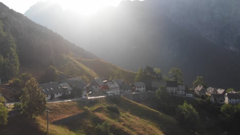 aerial view of strmec village in triglav national park, campers and cars driving