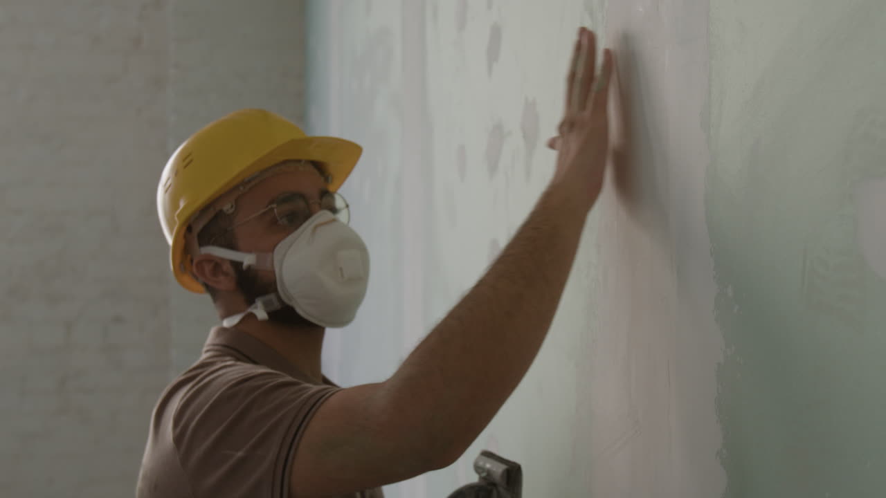 Man working on wall construction