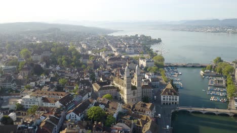 High-Aerial-View-of-Grossmunster-in-Historic-Downtown-Zurich,-Switzerland