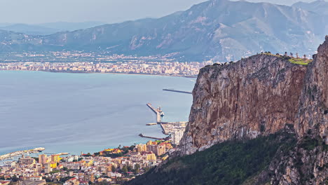 wide-view-of-Palermo-city,-boulevard,-shore-and-mountains,-hazy-summer-landscape-sight