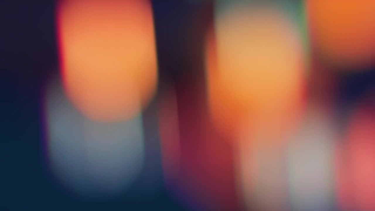 Cahaya Bokeh Abstrak Dinamis dengan Nuansa Oranye dan Hijau