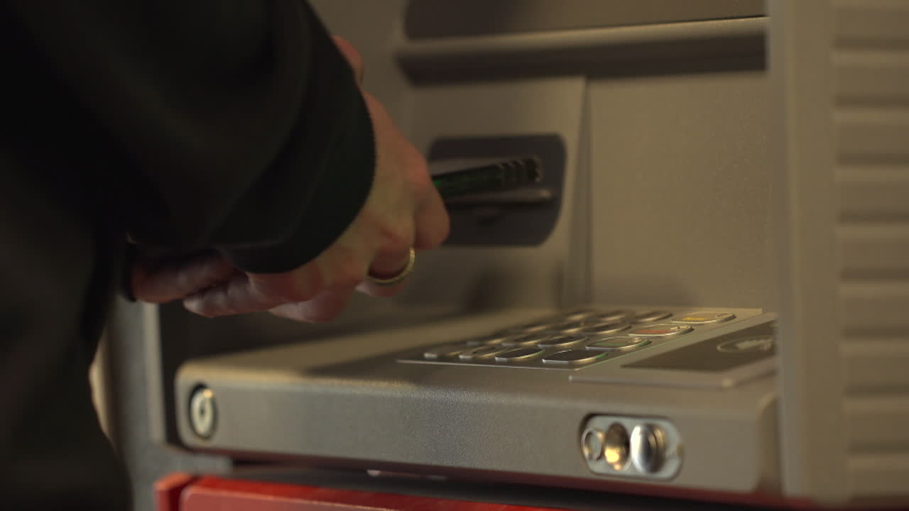 Person using an ATM machine