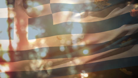 digital composition of greece waving flag over multiple autumn leaves falling against park