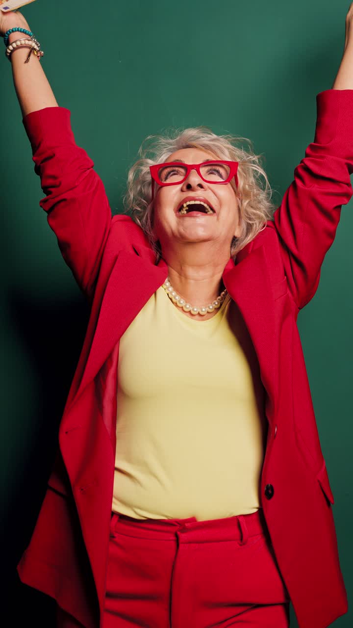 Happy Senior Woman Celebrating Financial Success with Euro Banknotes