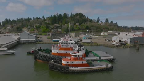 located in coos bay, oregon over the isthmus slough, showing tug boats at coos tug boat, shot with a dji mavic 3 drone