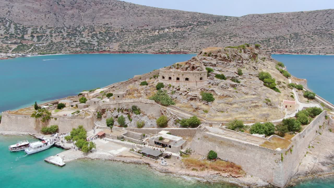 Spinalonga Island (Kalydon) fortress and pier. Landmark of Crete. Aerial Shot