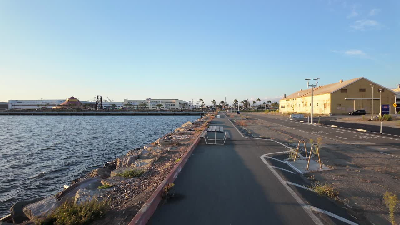 Bayfront scene of the Alameda Seaplane Lagoon Ferry Terminal with piers, docks, and waterfront features